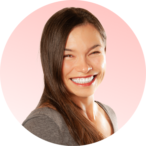 Woman with a bright smile on a pink background