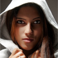 Woman wearing a hooded garment with a neutral background